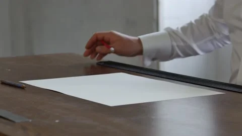 Concept architect engineer holding pen On the desk with a blueprint in the Stock Footage 143167170