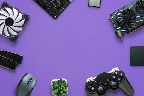 Concept of assembling a gaming computer on purple surface. Free space in the  Stock Photos