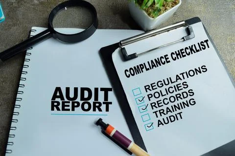 Concept of audit and compliance write on clipboard with business report Stock Photos