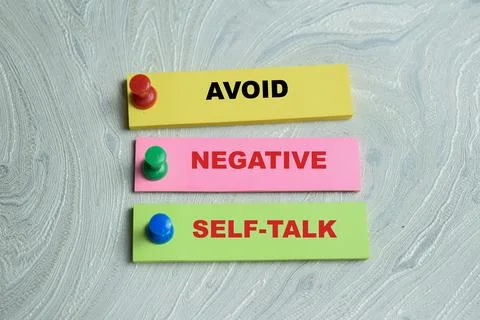 Concept of avoid negative self-talk write on sticky notes Stock Photos