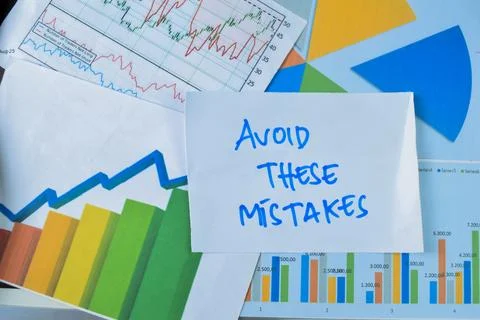 Concept of Avoid These Mistakes write on sticky notes isolated on Wooden Table Stock Photos