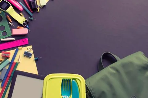 Concept back to school apple backpack stationery on black background. Stock Photos