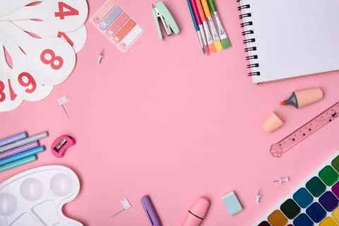 The concept of Back to School. School or office stationery yellow on a pink b Stock Photos