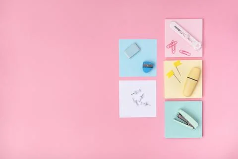 The concept of Back to school. School or office stationery on a pink backgrou Stock Photos