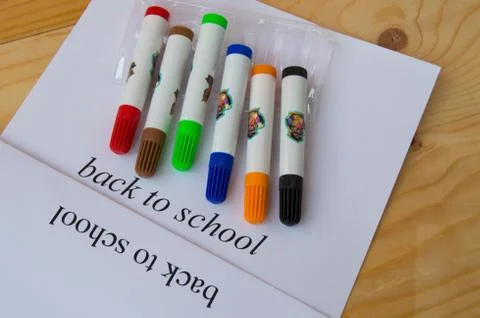 Concept back to school. Sheet of paper with text back to school and colorful  Stock Photos