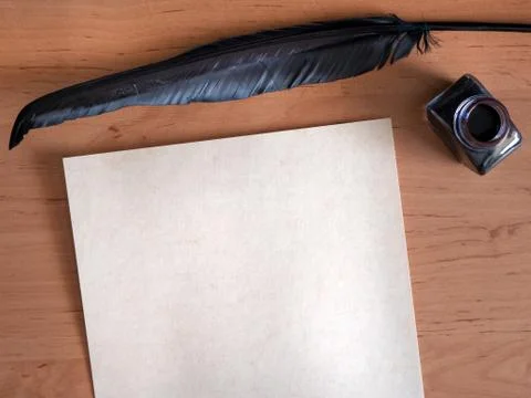 Concept Background: Old paper with ink bottle and black quill Stock Photos