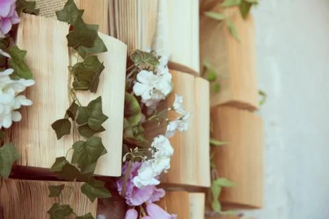Concept background opened books on the wall and flowers of artificial purple  Stock-Fotos