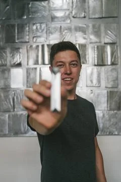 Concept of bad guy with top secret information. Man holding USB momory sti... Foto stock