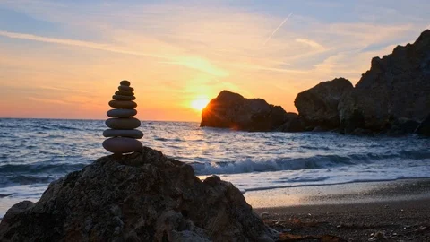 Concept of balance and harmony - stone stacks on the beach Stock Footage 111587550