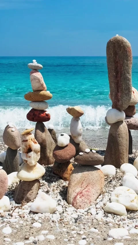 Concept of balance and harmony. - stone stacks on the beach Stock Footage 342414479