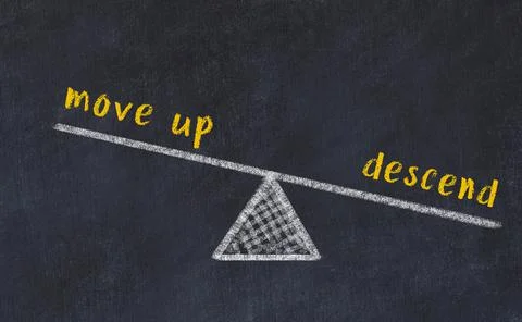 Concept of balance between move up and descend. Black chalboard with sketch o Foto stock