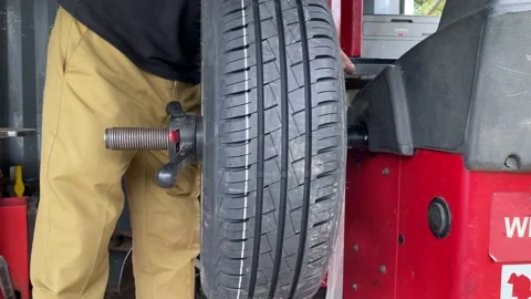 Concept balancing wheel in car service. Stock Footage 166457301