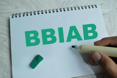 Concept of BBIAB - Be Back In A Bit write on book isolated on Wooden Table Foto stock