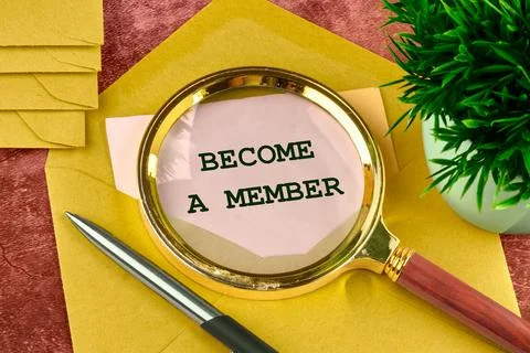 Concept. Become a member text through a magnifying glass in a letter peeking  Stock Photos