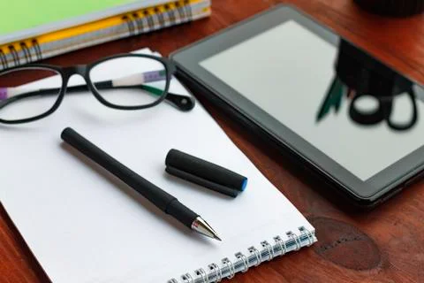 The concept: the beginning of work. Pen, open notebook, tablet computer and 写真素材