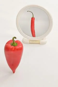 Concept Bell Pepper Reflection In Mirror on White Background Stock Photos