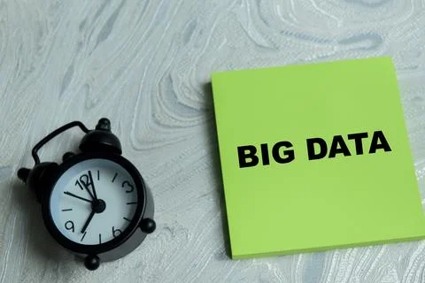 Concept of big data write on sticky notes isolated on Wooden Table. Stock Photos