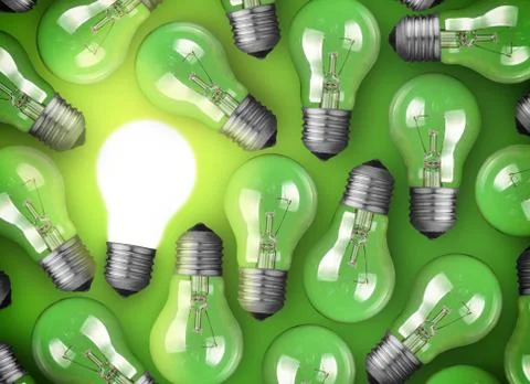 Concept for big idea. glowing light bulb on green background 库存照片