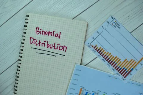 Concept of Binomial Distribution write on a book isolated on Wooden Table. Stock Photos