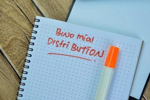 Concept of Binomial Distribution write on book isolated on Wooden Table. Fotos de archivo