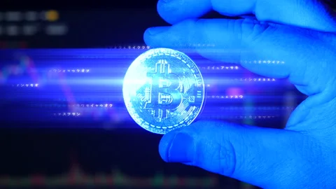 Concept of Bitcoin BTC digital crypto currency emitting elcetricity and Stock Footage 160949874
