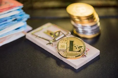 Concept of bitcoin in a  mouse trap. Risks and dangers of investing in the cr Stock Photos