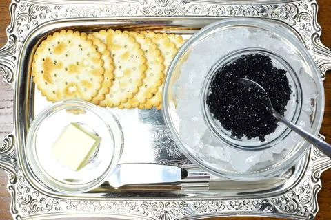 Concept with black caviar Stock Photos
