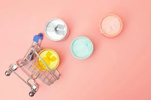 Concept black friday, gift boxes with shopping cart on pink pastel background Stock Photos