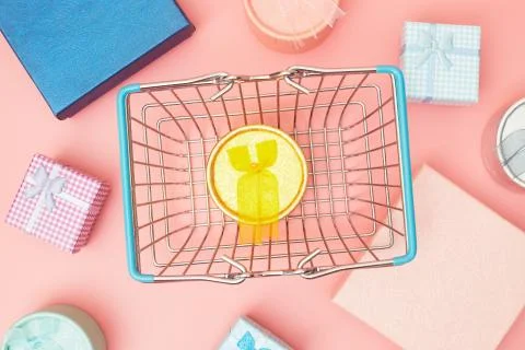 Concept black friday, gift boxes with shopping cart on pink pastel background Stock Photos