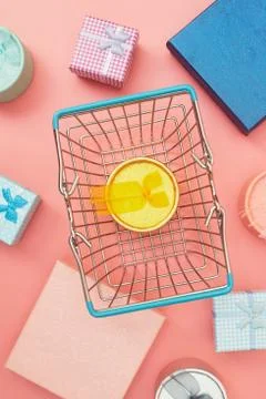 Concept black friday, gift boxes with shopping cart on pink pastel background Stock Photos