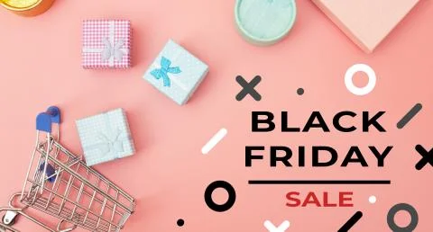 Concept black friday, gift boxes with shopping cart on pink pastel background Stock Photos