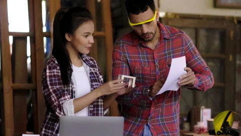 Concept blue collar worker. carpenter is designing furniture models in wood Stock Footage 205799192