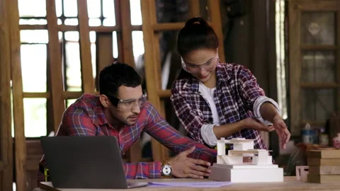 Concept blue collar worker. carpenter is designing furniture models in wood Stock Footage 205801137