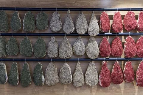 Concept: a board of raw ham imitating the italian flag Stock Photos