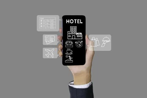 The concept of booking hotel accommodation and paying via mobile banking is.. Stock Photos