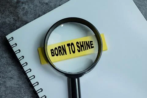 Concept of born to shine write on sticky notes isolated on Wooden Table. Stock Photos