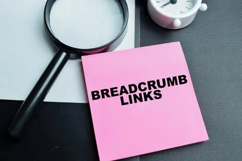 Concept of breadcrumb links write on sticky notes isolated on table. Stock Photos