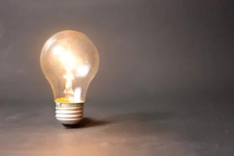 Concept of bright idea with light bulb Stock Photos