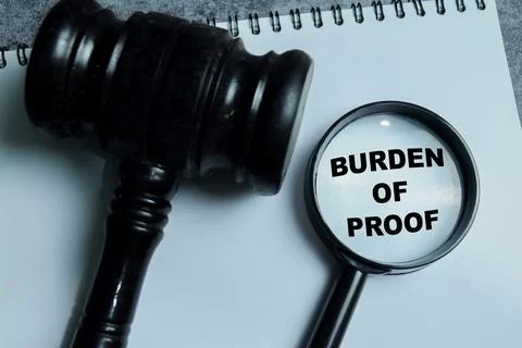 Concept of burden of proof write on book with isolated on Wooden Table. Stock Photos