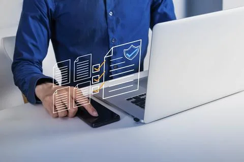 The concept of a businessman's work is to verify documents and conditions w.. Stock Photos