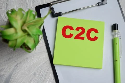 Concept of C2C write on sticky notes isolated on Wooden Table. Stock Photos