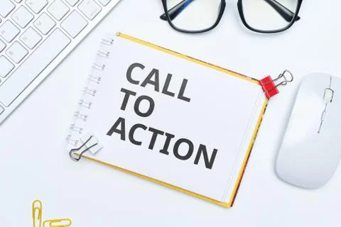 Concept call to action lettering on notepad Stock Photos