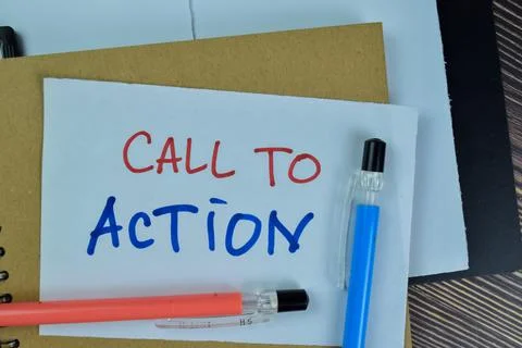 Concept of Call To Action write on sticky notes isolated on Wooden Table. Stock Photos