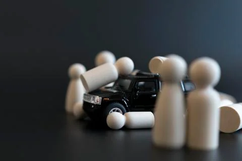 Concept Car Terrorism. The car knocks down pedestrians. Wooden figures of peo Stock Photos