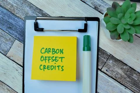 Concept of Carbon Offset Credits write on sticky notes Stock Photos