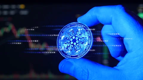 Concept of Cardano ADA digital cryptocurrency emitting electricity and Stock Footage 160949321
