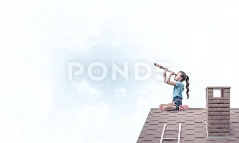 Concept of careless happy childhood with girl looking in spyglas Stock Photos