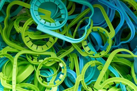 The concept of caring for the environment. Many different plastic bottle caps Stock Photos