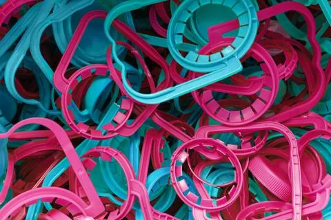 The concept of caring for the environment. Many different plastic bottle caps Stock Photos