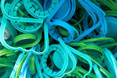 The concept of caring for the environment. Many different plastic bottle caps Stock Photos